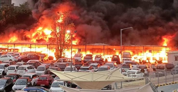 Large vehicle fire at commercial car park illustrating EV battery fire risk